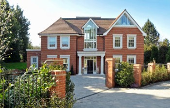 Domestic window cleaning at a modern home in Exeter using a pure water window cleaning system.